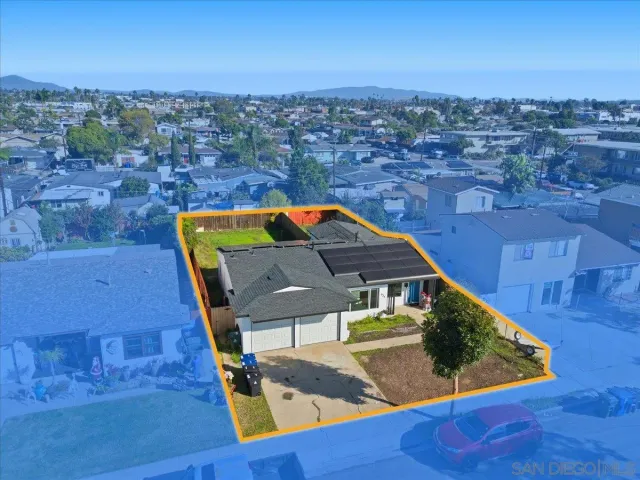 an aerial view of a houses with a swimming pool