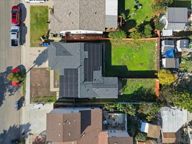 an aerial view of a house with a ocean view