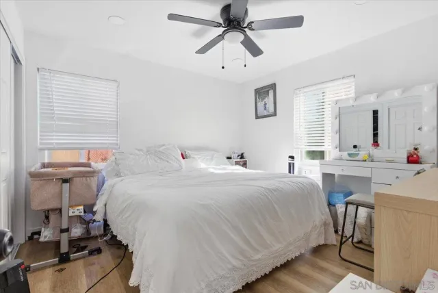 a bedroom with a bed and a table in it