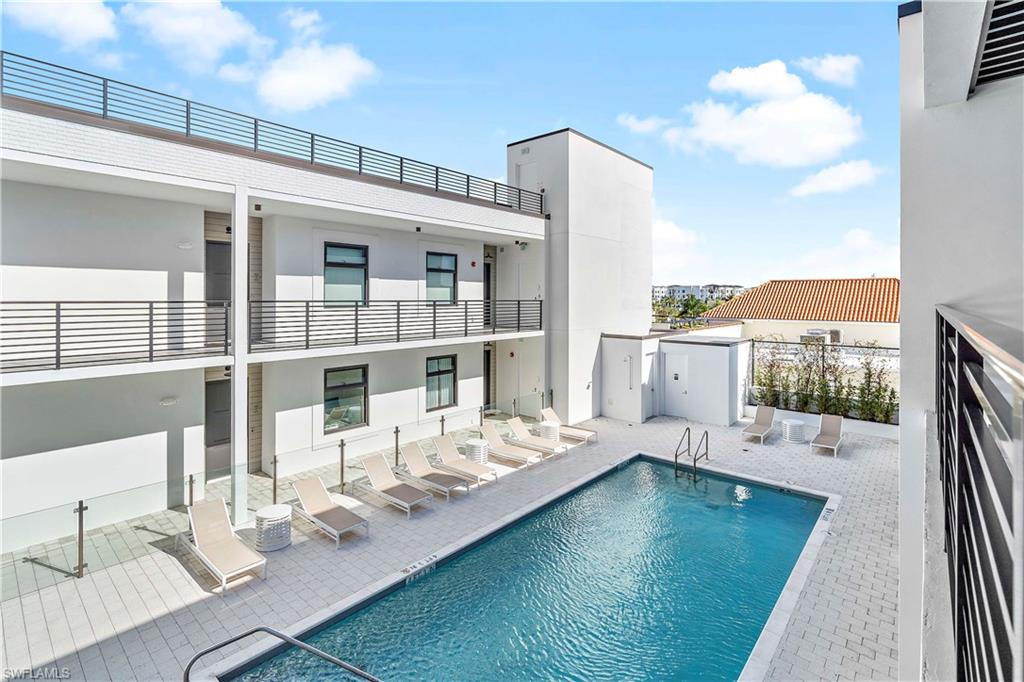 850 Central Avenue, Unit 310 Naples, FL 34102 - Photo 16 of 21 a view of a living room and dining room