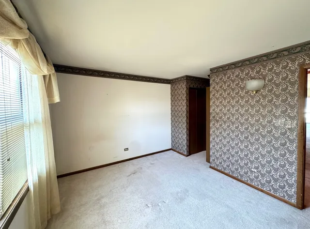 an empty room with a empty space and windows