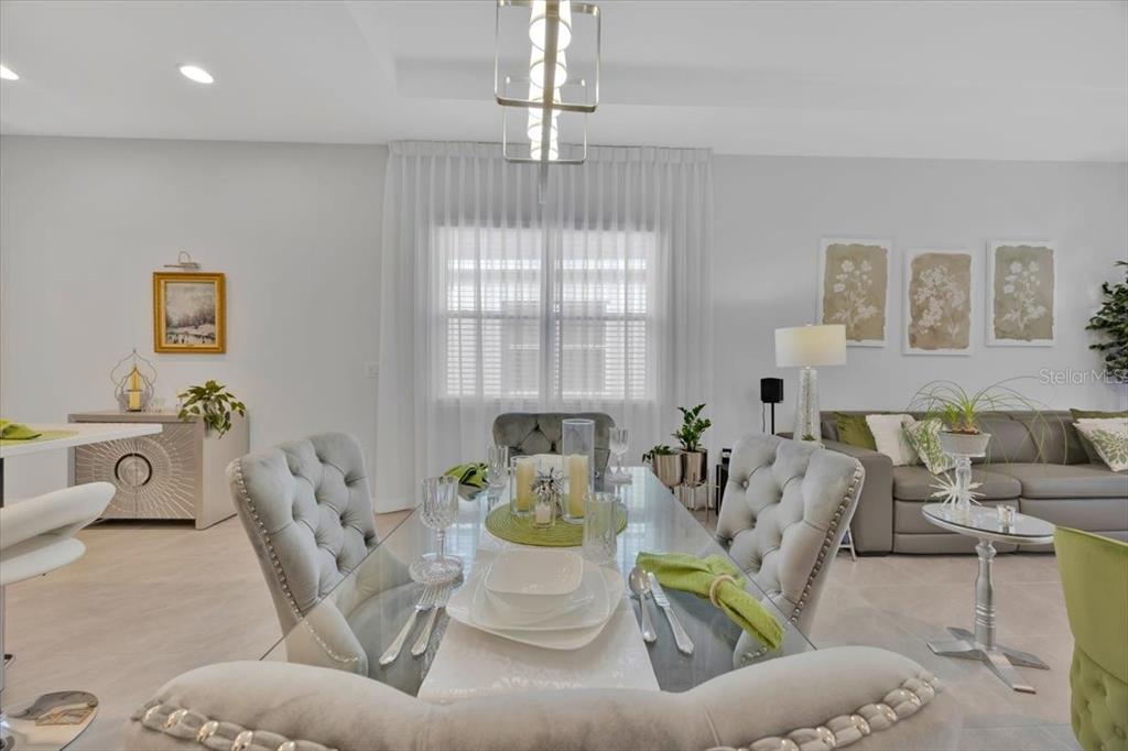 2031 Key Bay Trail Kissimmee, FL 34747 - Photo 11 of 46 a living room with furniture and a chandelier