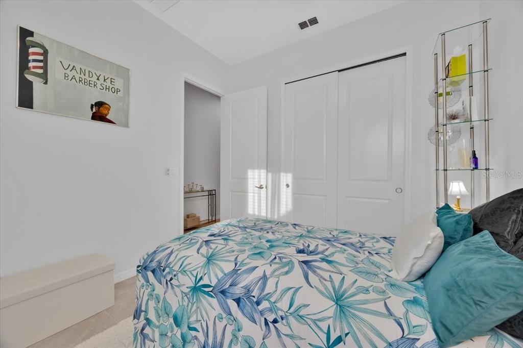 2031 Key Bay Trail Kissimmee, FL 34747 - Photo 20 of 46 a bedroom with a bed and a window