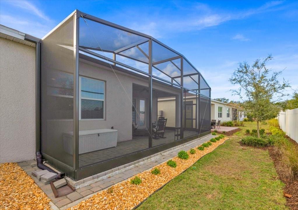 2031 Key Bay Trail Kissimmee, FL 34747 - Photo 27 of 46 a view of a house with pool and wooden walls