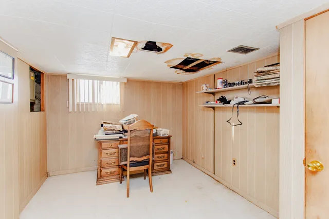 a dining room with furniture and window