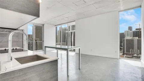 a view of a living room and bathroom