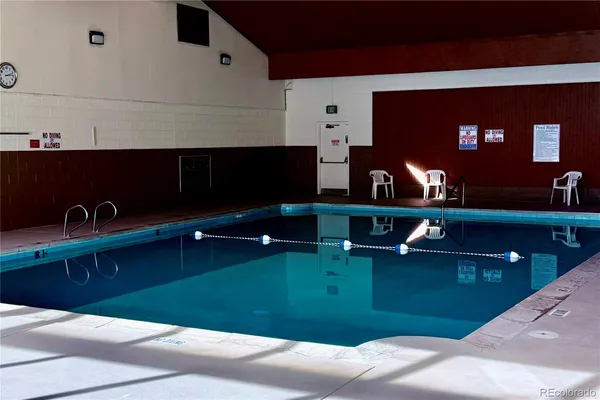 a kitchen with kitchen island a sink and a fireplace