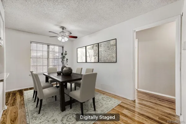a view of a dining room with furniture window and wooden floor