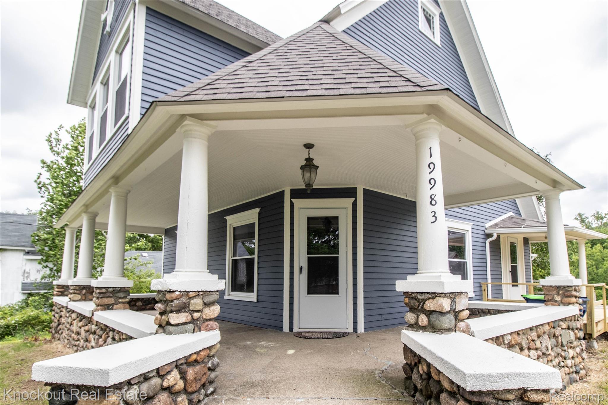 19983 West Ridge Road Henderson, MI 48841 - Photo 4 of 76 Covered front porch featuring white columns and stone bases