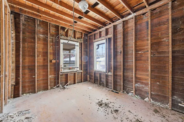 a view of a porch with a wooden door