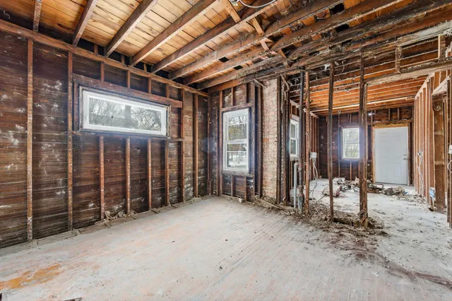 a view of an empty room with wooden walls