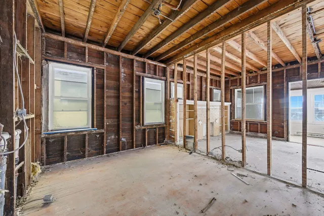 a view of an empty room with wooden frame