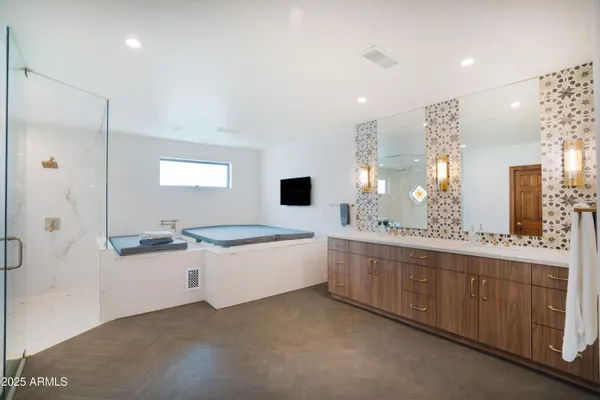 a bedroom with a bed and a night stand