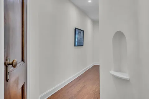 a view of a room with a large window and chair