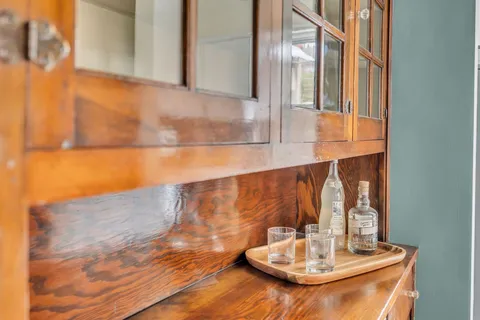 a kitchen with a refrigerator a sink and a stove top oven