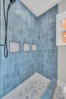 a front view of a house with yard and green space