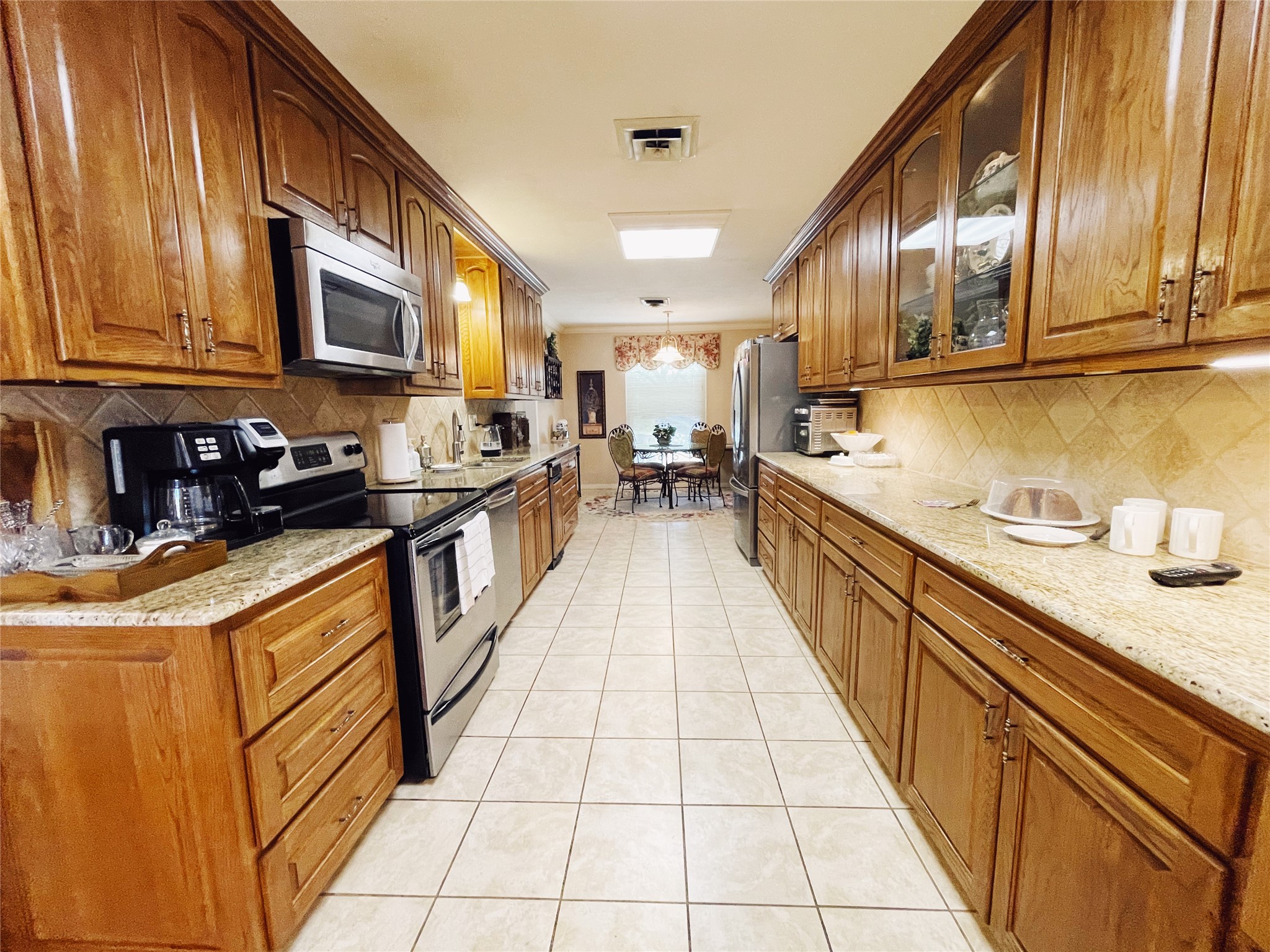 700 Shanklin Road Belton, TX 76513 - Photo 12 of 33 a kitchen with stainless steel appliances granite countertop a sink stove and cabinets