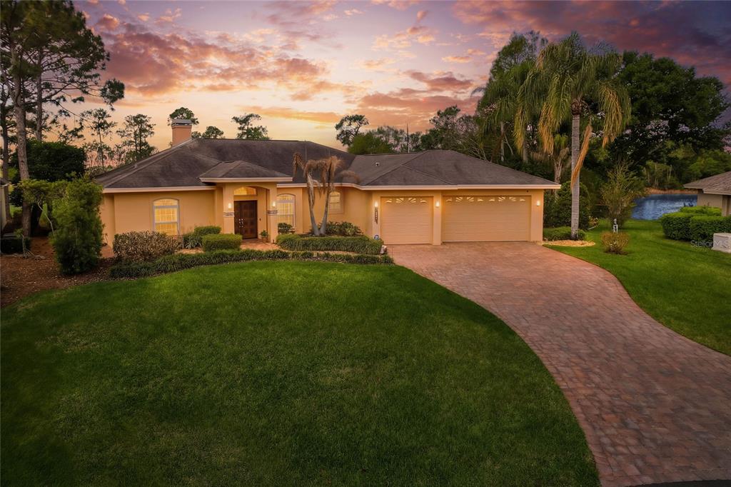 2968 Plantation Road Winter Haven, FL 33884 - Photo 4 of 81 a front view of a house with a garden and yard