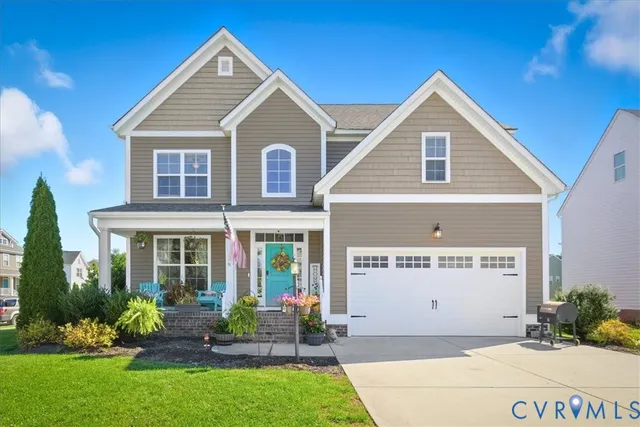 a view of a house with a yard and plants