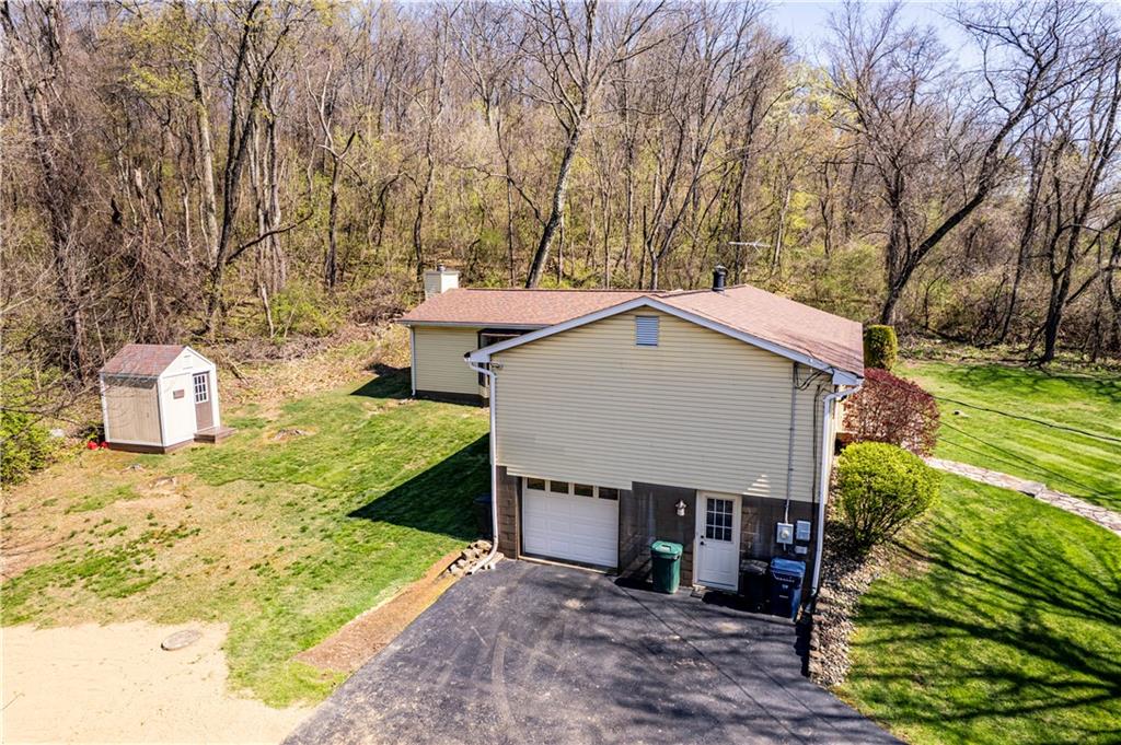 2037 Ridge Road Jeannette, PA 15644 - Photo 23 of 24 front view of a house with a yard