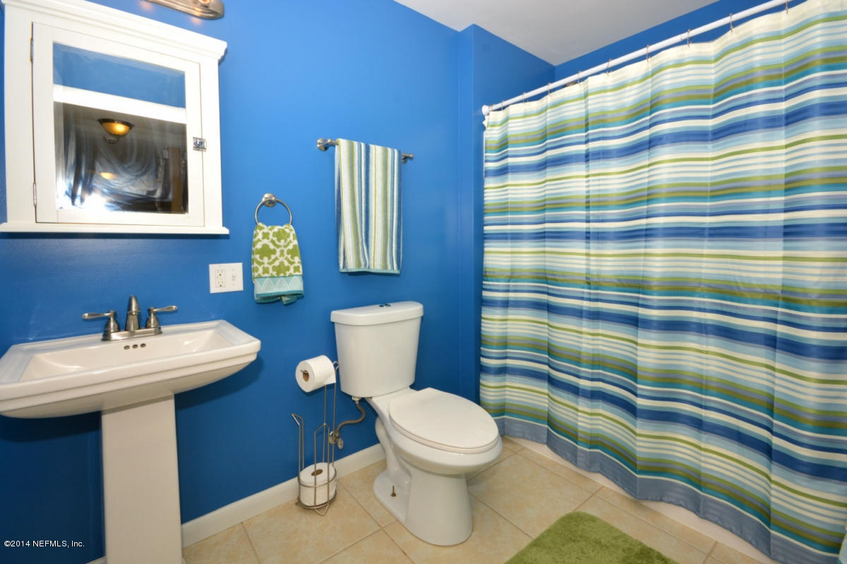 81 Kings Ferry Way St. Augustine, FL 32084 - Photo 18 of 24 a bathroom with a sink a toilet and mirror