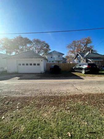 a view of a car in front of a house