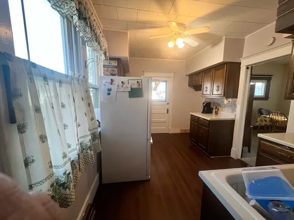 a kitchen with refrigerator and sink