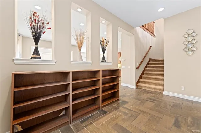 a view of wooden floor and windows in a room