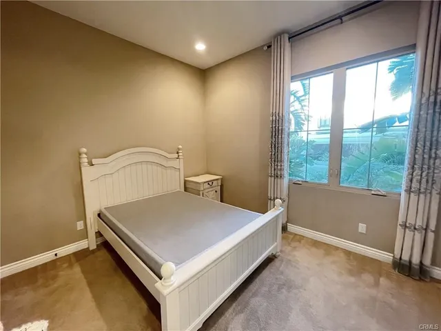 a room with a bed and a window