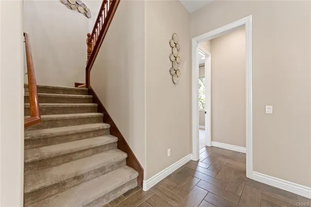 a view of an entryway with wooden floor
