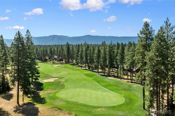 a view of a golf course with a swimming pool