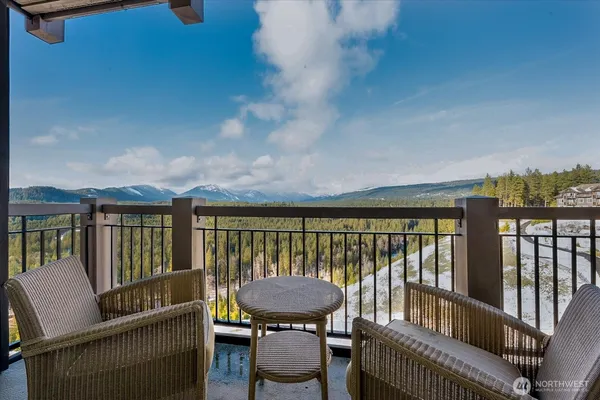 a view of a balcony with furniture