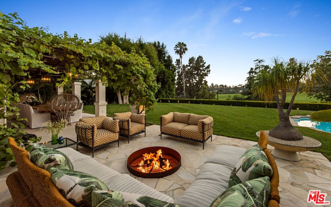 9966 Sunset Boulevard Beverly Hills, CA 90210 - Photo 54 of 58 a view of a swimming pool with a patio