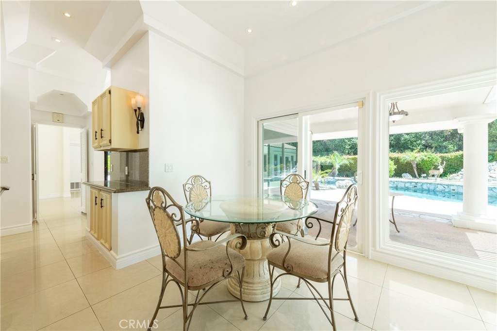 16379 Meadow Ridge Road West Encino, CA 91436 - Photo 14 of 40 a dining room with furniture and window