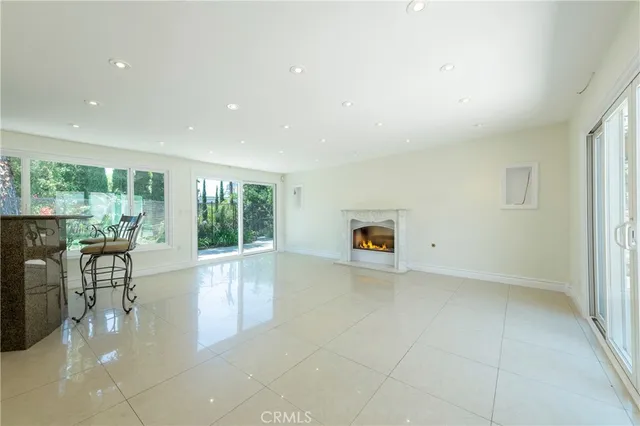 a view of a living room a patio and a garden