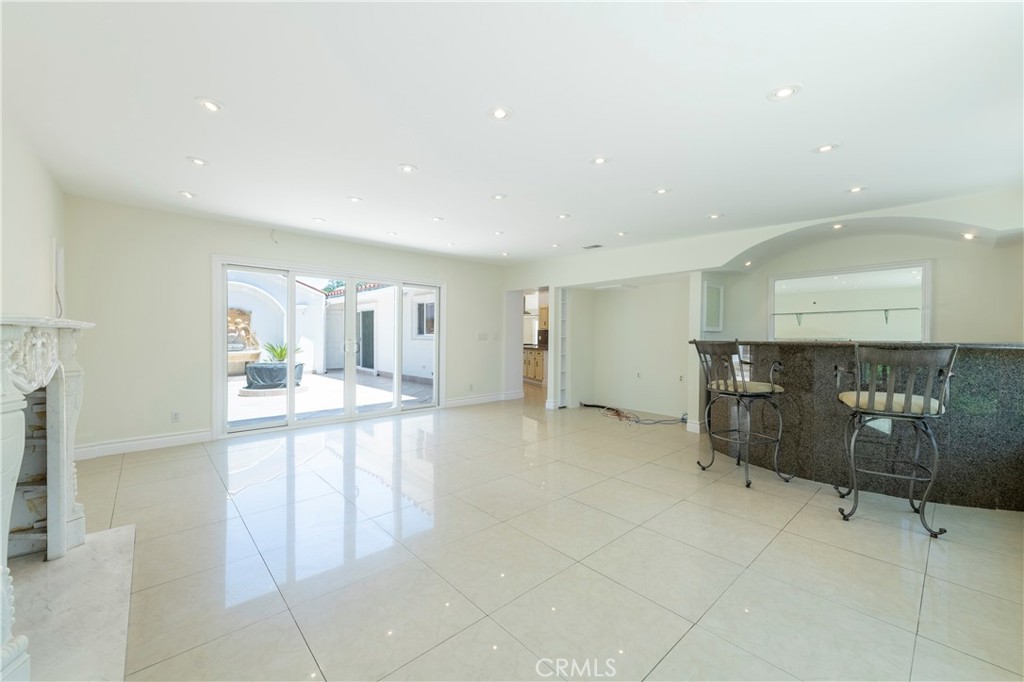 16379 Meadow Ridge Road West Encino, CA 91436 - Photo 16 of 40 a view of a living room hardwood floor and a ceiling fan