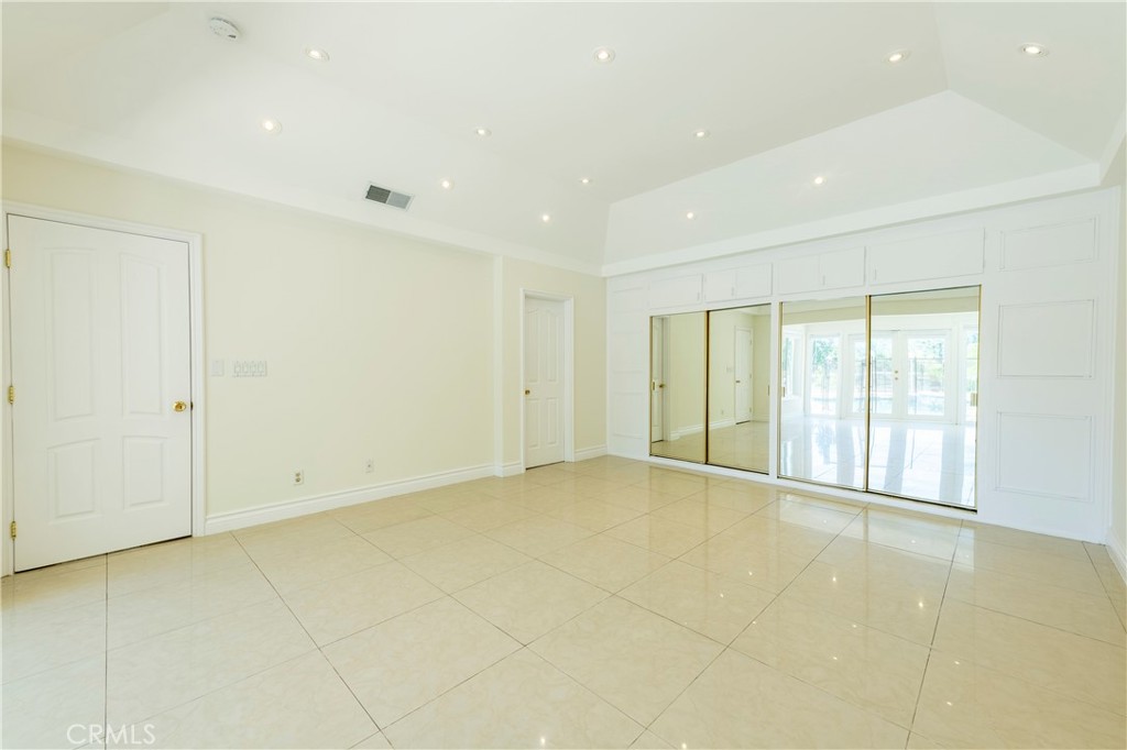 16379 Meadow Ridge Road West Encino, CA 91436 - Photo 21 of 40 a view of an empty room with a window