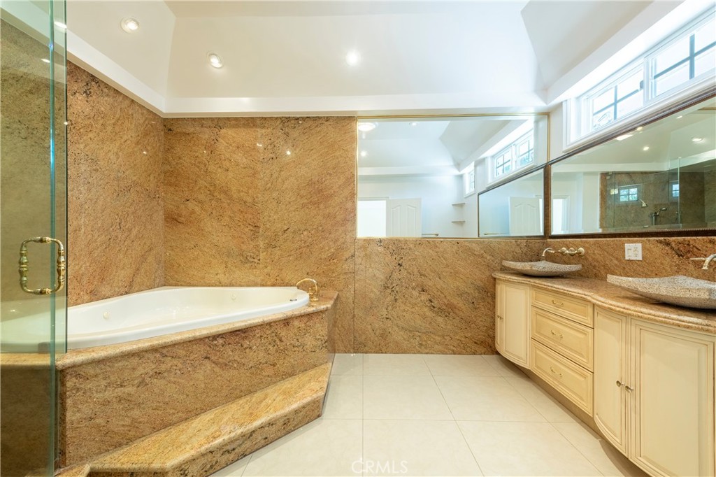 16379 Meadow Ridge Road West Encino, CA 91436 - Photo 22 of 40 a bathroom with a bathtub and a sink