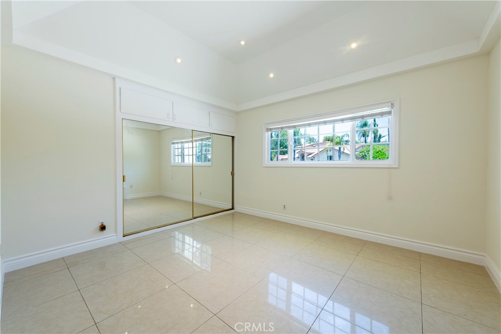 16379 Meadow Ridge Road West Encino, CA 91436 - Photo 25 of 40 a view of an empty room with windows