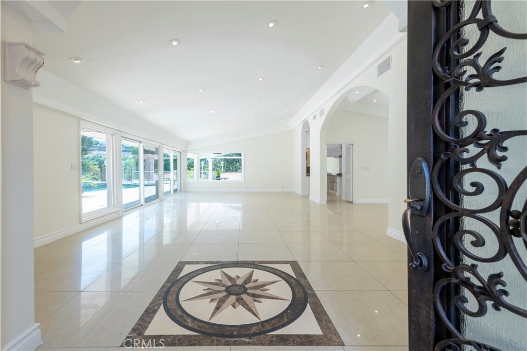 16379 Meadow Ridge Road West Encino, CA 91436 - Photo 3 of 40 a view of an entryway with wooden floor