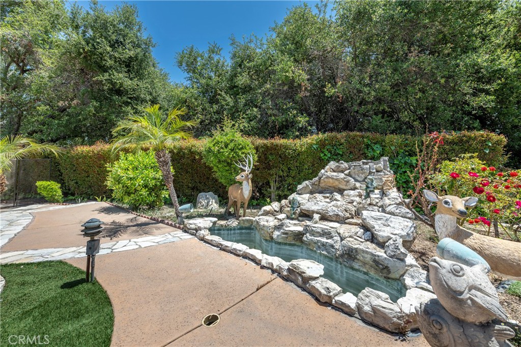 16379 Meadow Ridge Road West Encino, CA 91436 - Photo 32 of 40 a view of backyard with outdoor seating and green space