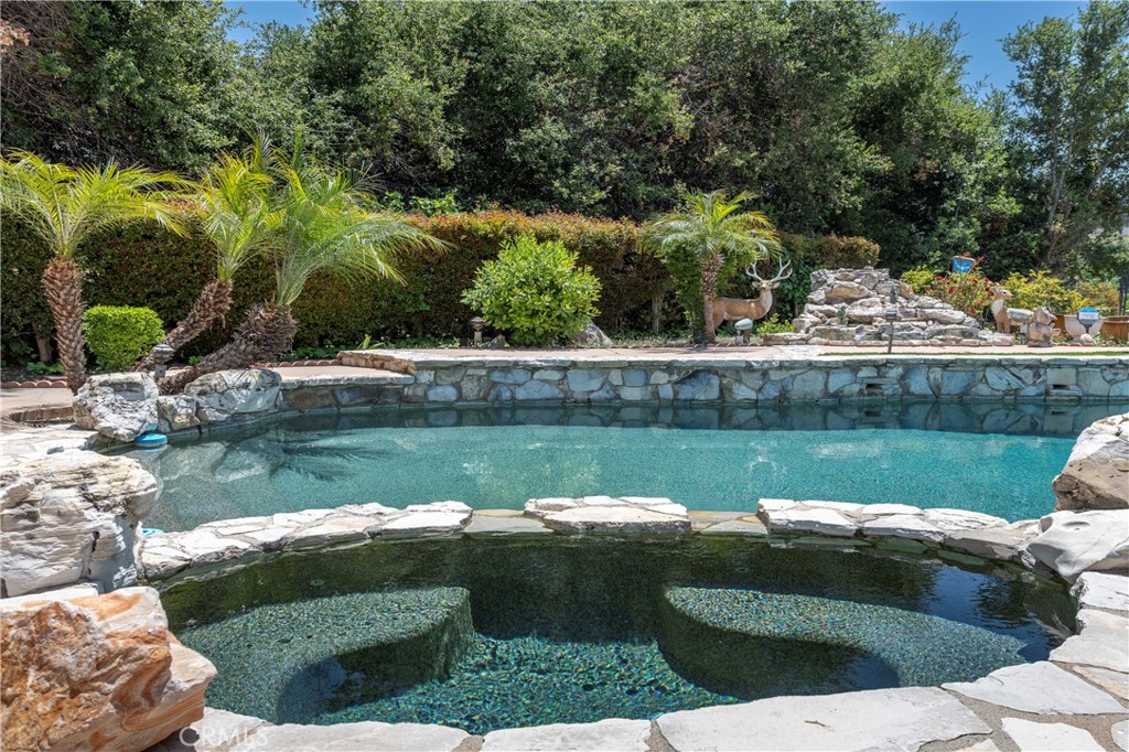 16379 Meadow Ridge Road West Encino, CA 91436 - Photo 33 of 40 a view of a lake from a garden