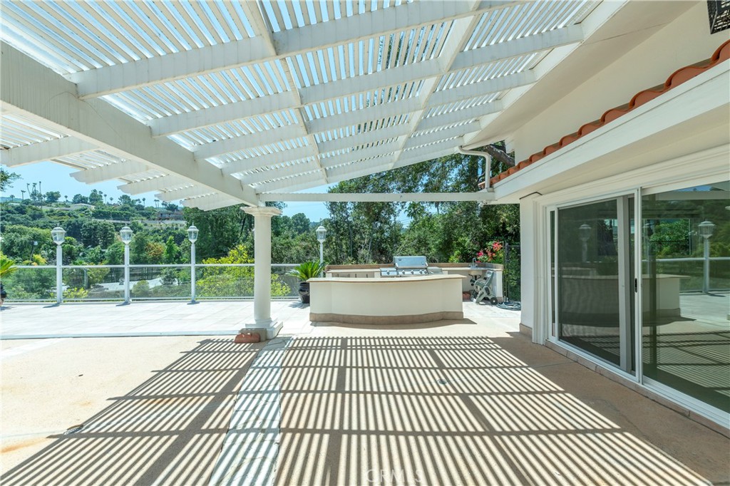 16379 Meadow Ridge Road West Encino, CA 91436 - Photo 35 of 40 a view of a patio with wooden floor