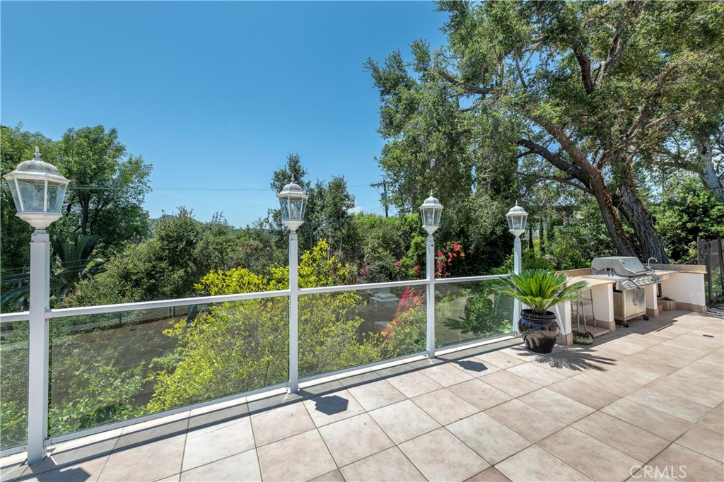 16379 Meadow Ridge Road West Encino, CA 91436 - Photo 37 of 40 a view of a chair and table in the backyard