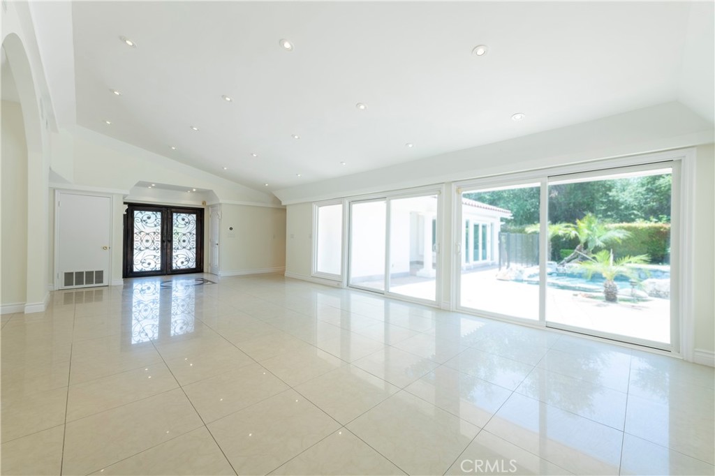 16379 Meadow Ridge Road West Encino, CA 91436 - Photo 4 of 40 a view of an empty room with a window