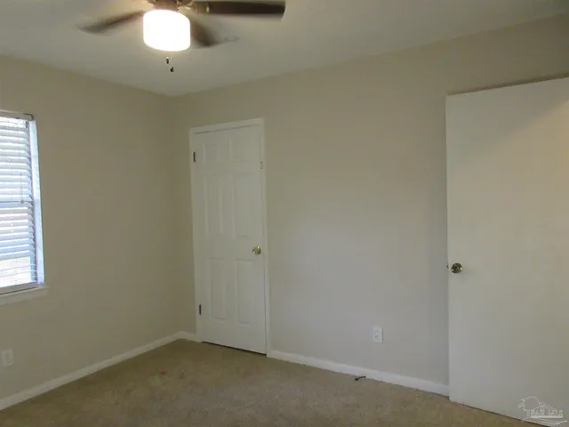 a view of a room with windows