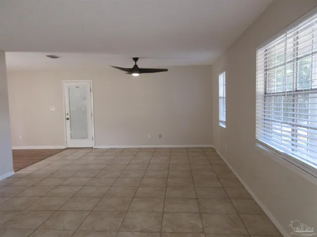a view of an empty room and window