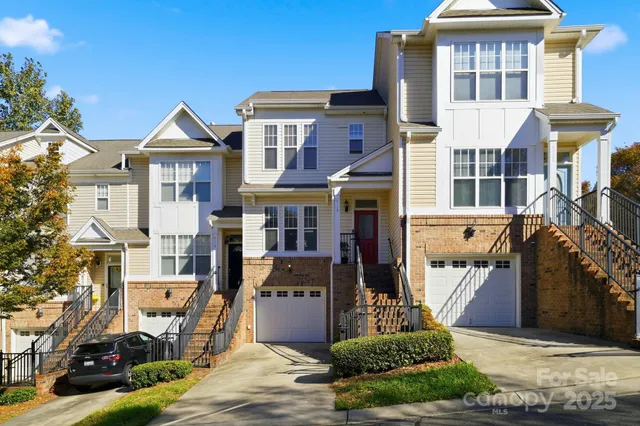a front view of a houses on the roadside