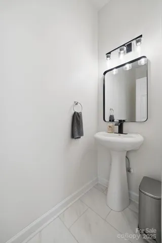 a bathroom with a sink and mirror