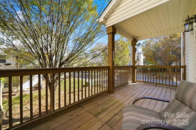 a view of balcony with wooden floor